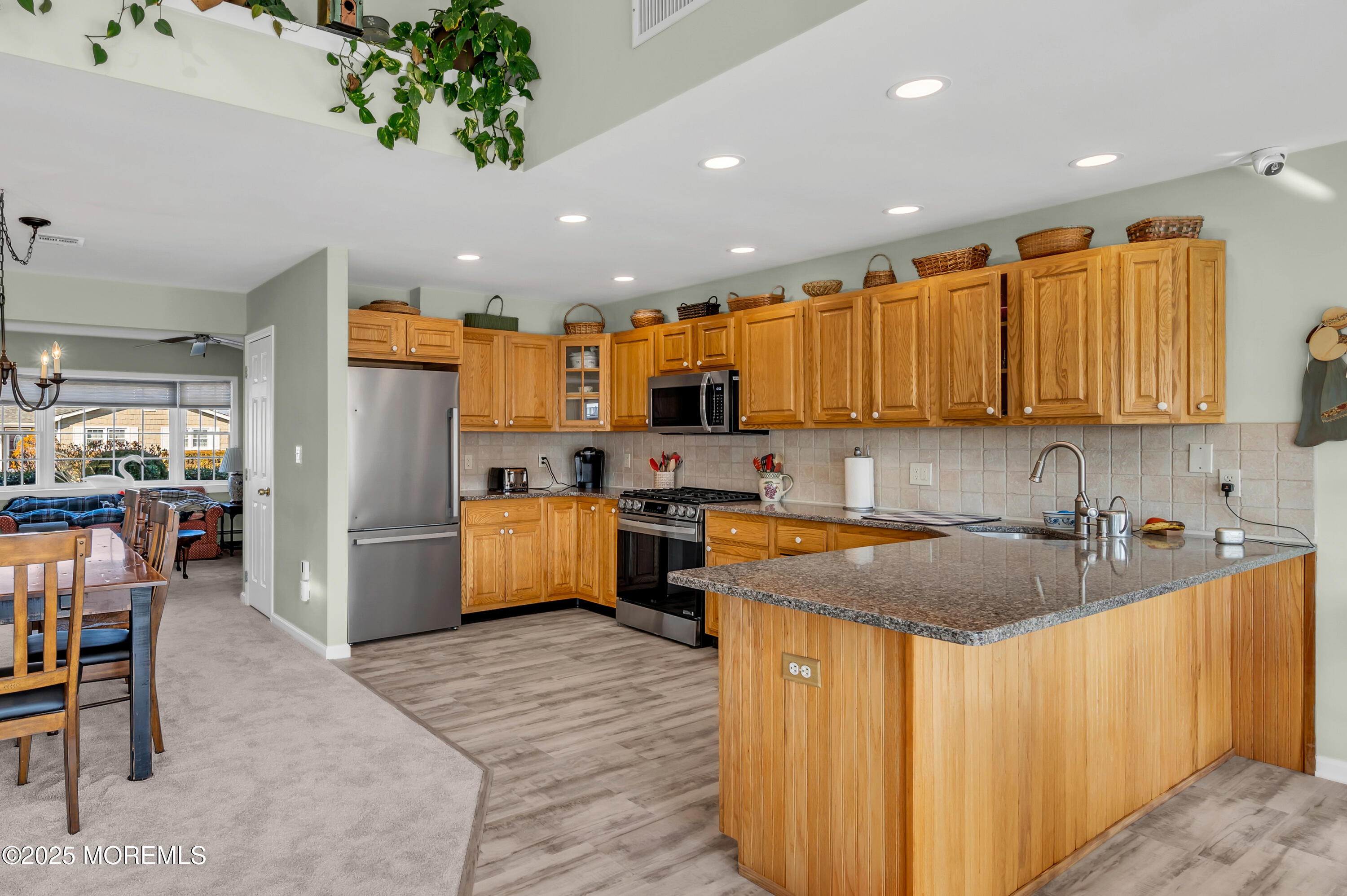 837 Forepeak Drive Forked River, NJ 08731 - Photo 41 of 55 a kitchen with refrigerator and chairs