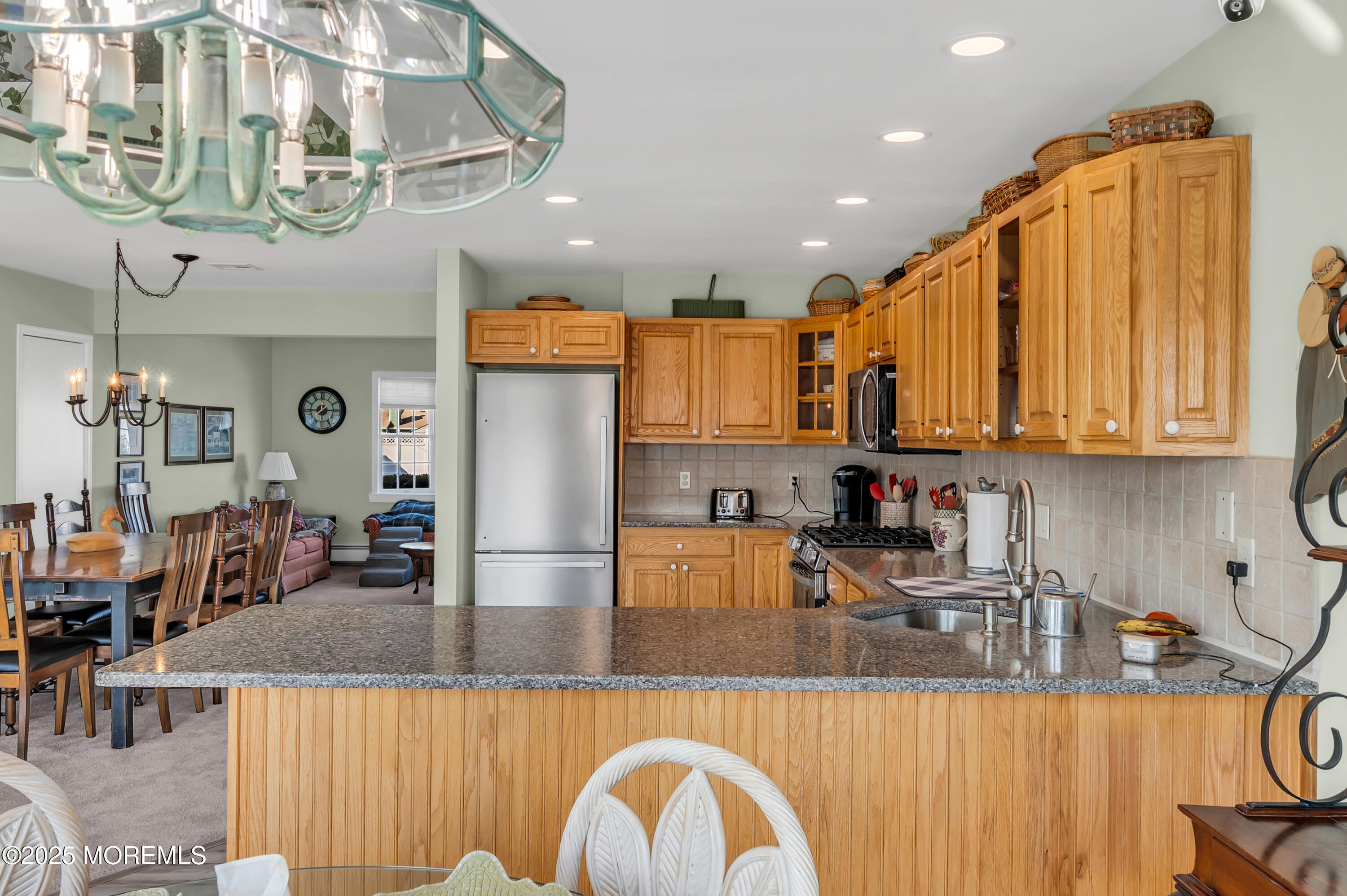 837 Forepeak Drive Forked River, NJ 08731 - Photo 43 of 55 a kitchen with stainless steel appliances granite countertop a sink a counter space and cabinets
