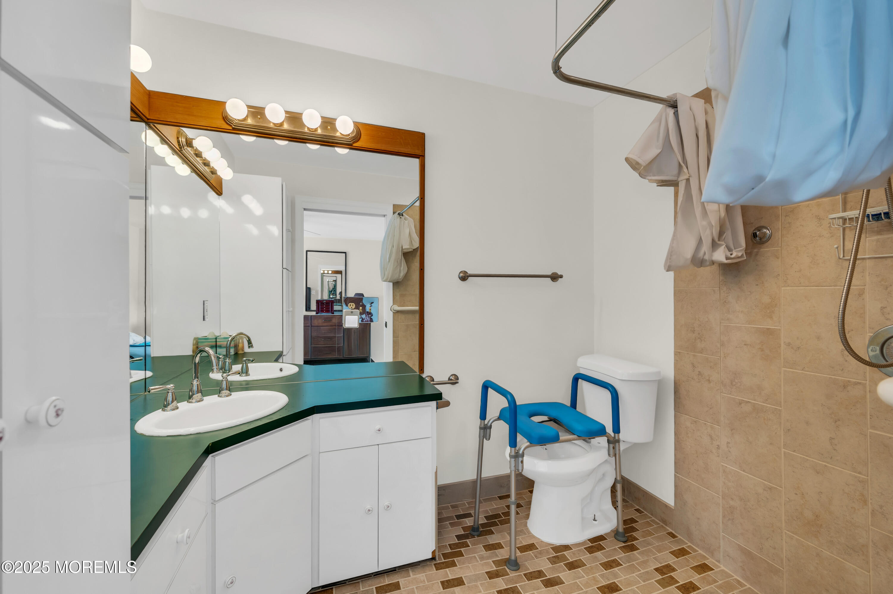 837 Forepeak Drive Forked River, NJ 08731 - Photo 53 of 55 a bathroom with a sink a toilet and mirror