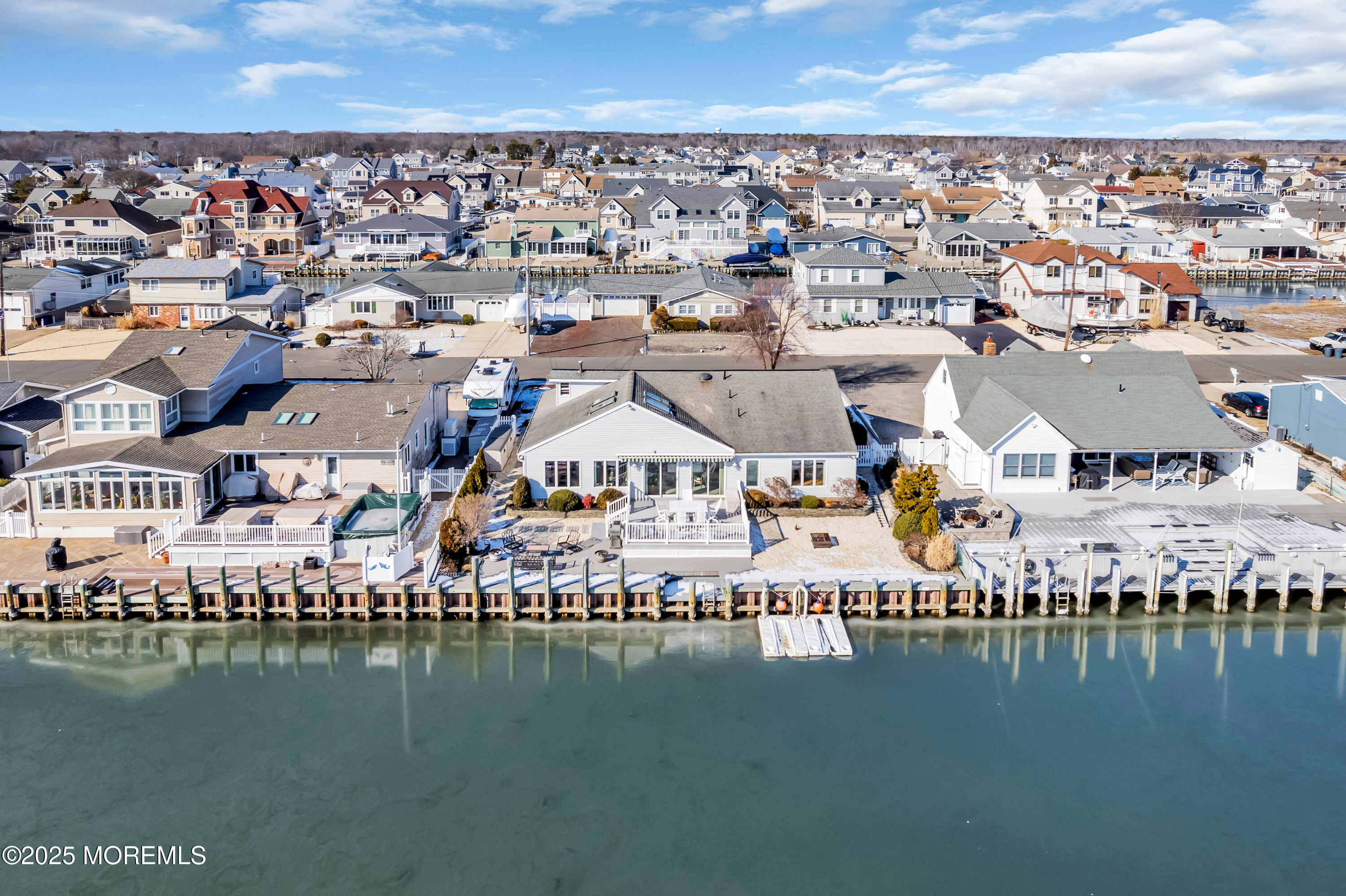 837 Forepeak Drive Forked River, NJ 08731 - Photo 8 of 55 an aerial view of a ocean with boats and trees all around