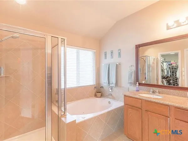 a bathroom with a bathtub and a sink