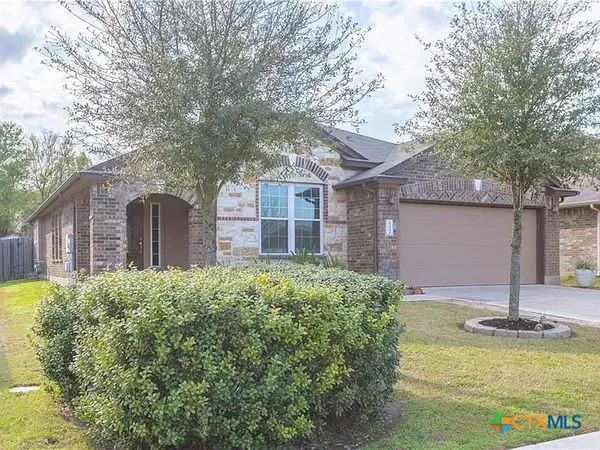 a view of a house with pool and tree s