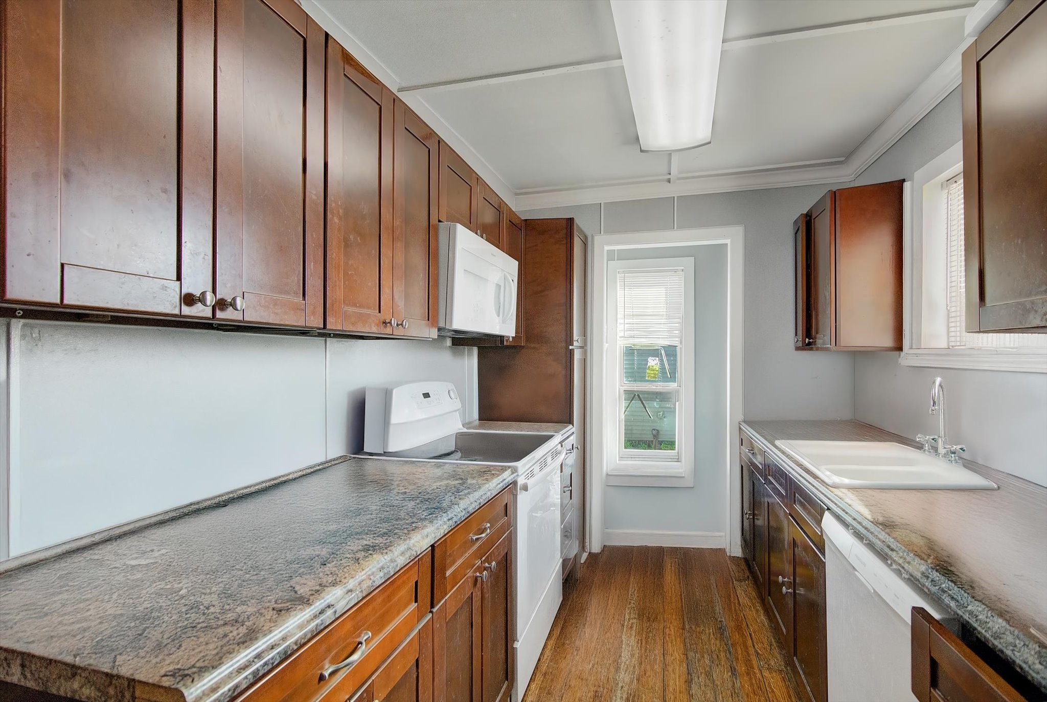 14929 Henry Road Houston, TX 77060 - Photo 6 of 13 a kitchen with stainless steel appliances granite countertop a sink a stove and cabinets