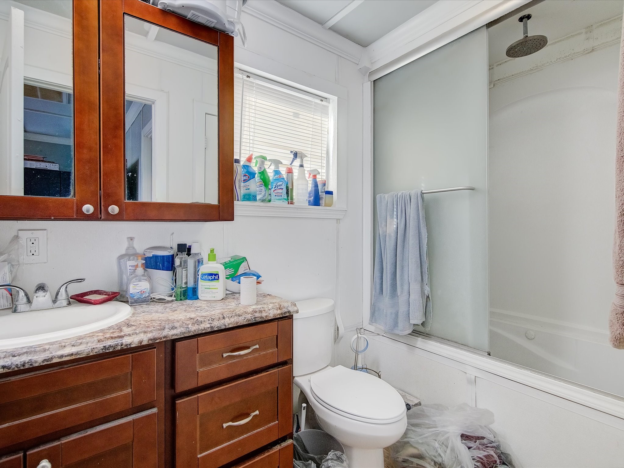 14929 Henry Road Houston, TX 77060 - Photo 8 of 13 a bathroom with a granite countertop sink mirror vanity and toilet