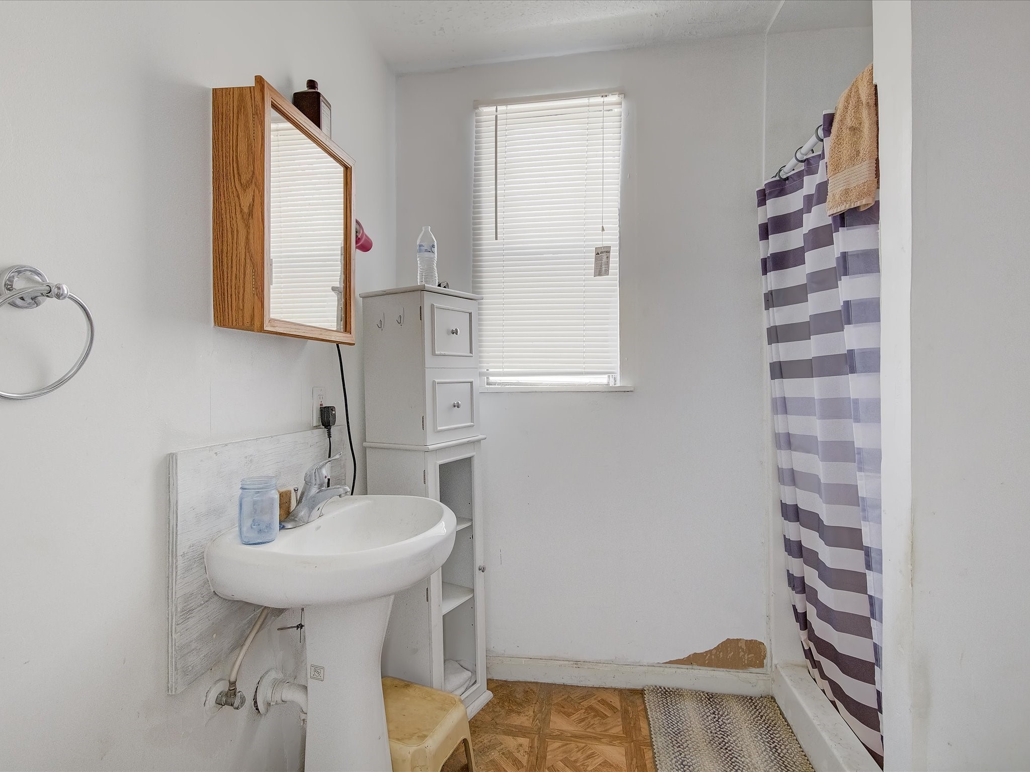 14929 Henry Road Houston, TX 77060 - Photo 10 of 13 a bathroom with a sink and a mirror