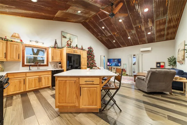 a view of a kitchen with furniture and a kitchen