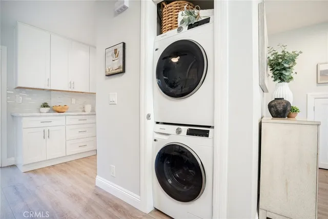 a view of a hallway with washer and dryer
