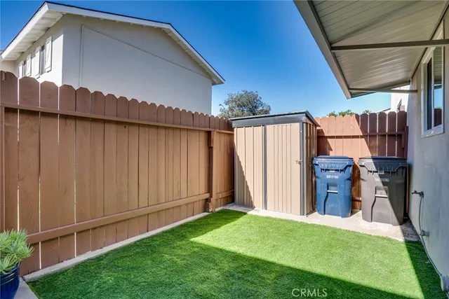 a view of a backyard of the house