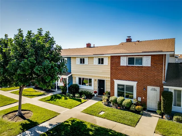 a front view of a house with swimming pool having outdoor seating