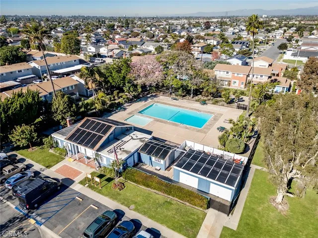 an aerial view of a house with a swimming pool