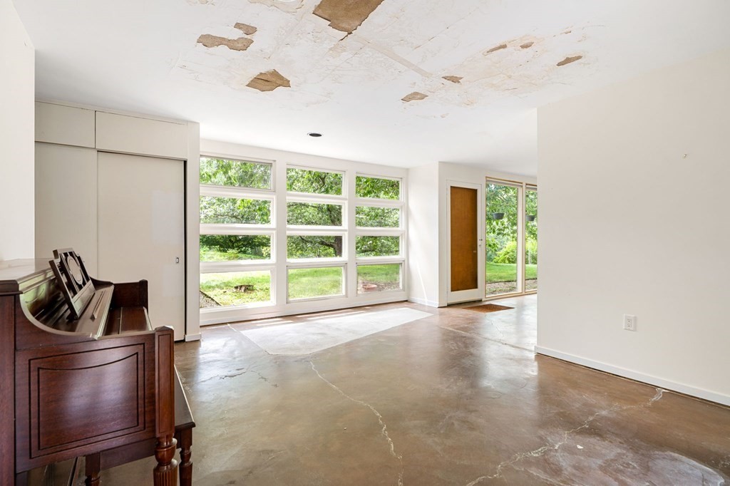 91 Weston Road Lincoln, MA 01773 - Photo 20 of 34 a view of an empty room with a window