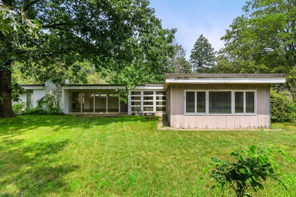 91 Weston Road Lincoln, MA 01773 - Photo 2 of 34 a front view of house with yard and green space