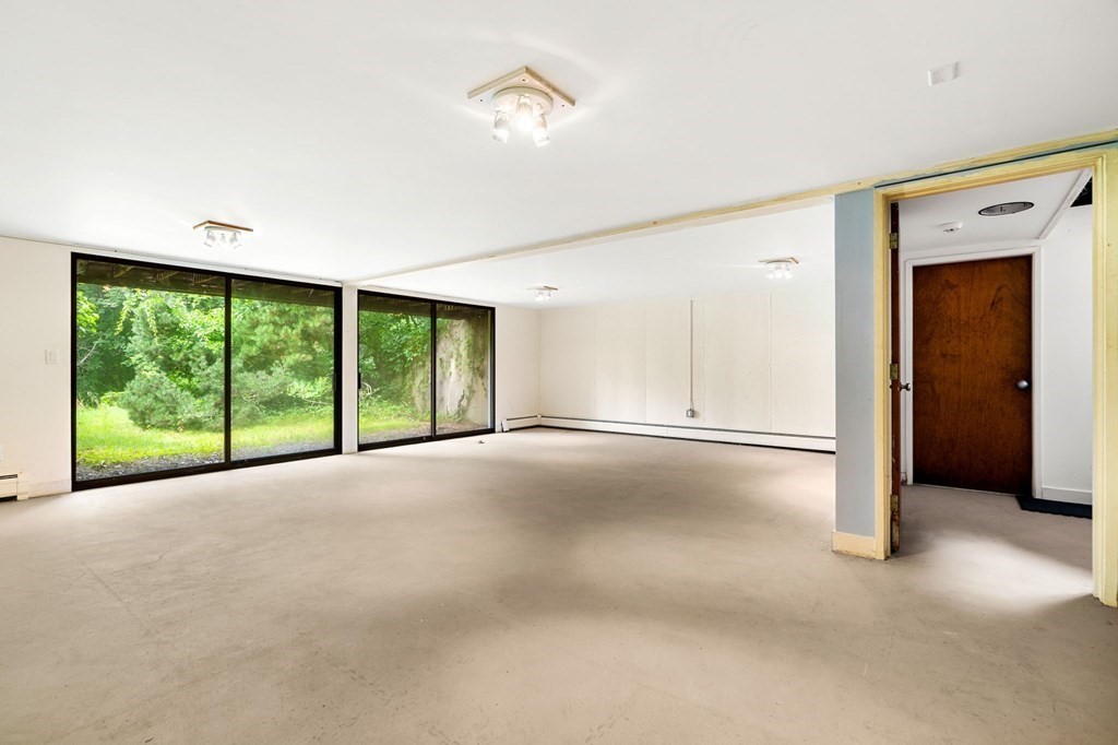 91 Weston Road Lincoln, MA 01773 - Photo 25 of 34 a view of empty room with floor to ceiling window