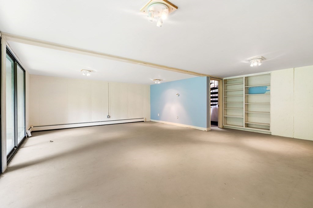 91 Weston Road Lincoln, MA 01773 - Photo 26 of 34 an empty room with a empty space and window
