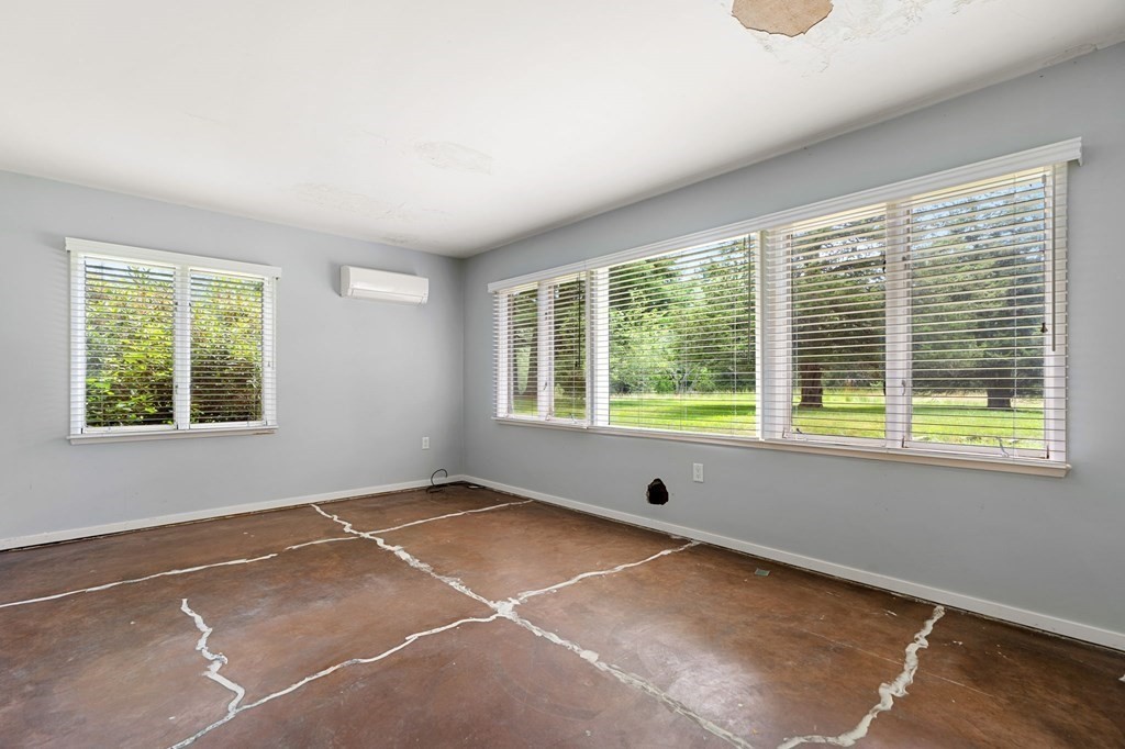 91 Weston Road Lincoln, MA 01773 - Photo 27 of 34 a view of an empty room with a window