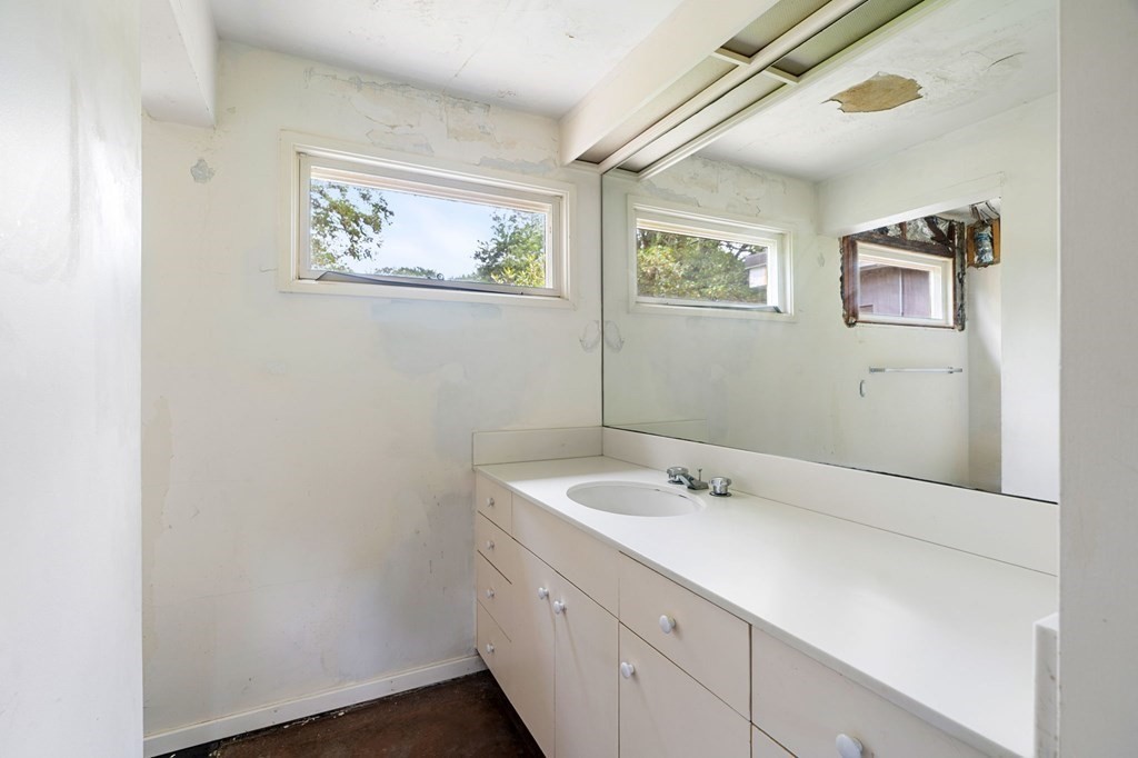 91 Weston Road Lincoln, MA 01773 - Photo 28 of 34 a bathroom with a sink and a mirror