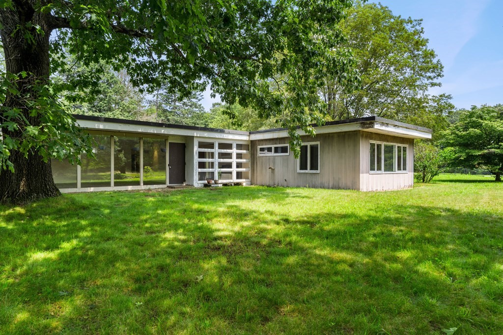 91 Weston Road Lincoln, MA 01773 - Photo 3 of 34 a view of a house with yard and tree s