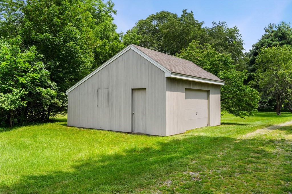91 Weston Road Lincoln, MA 01773 - Photo 32 of 34 a view of a backyard with a garden