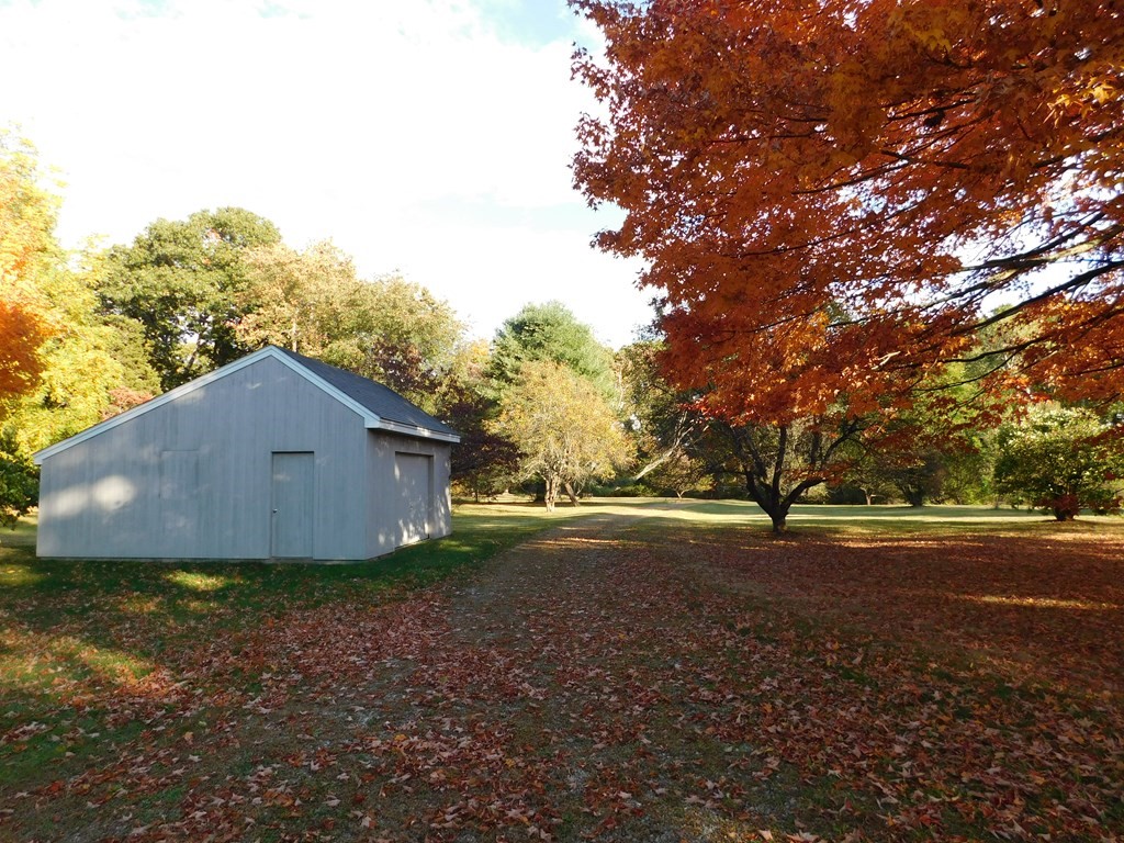 91 Weston Road Lincoln, MA 01773 - Photo 34 of 34 a view of a yard with large trees