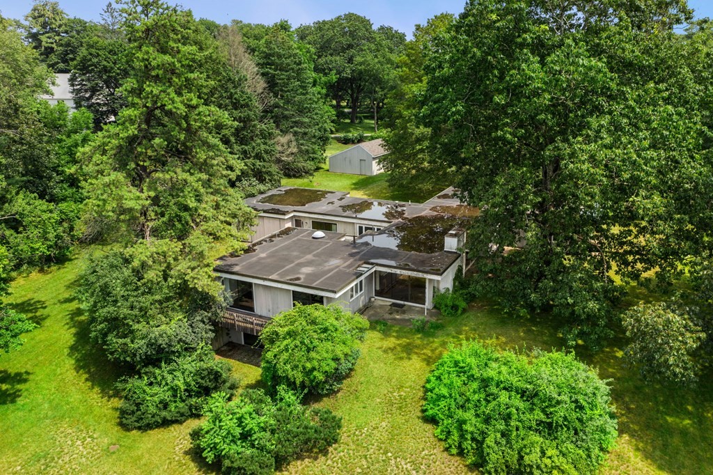 91 Weston Road Lincoln, MA 01773 - Photo 4 of 34 an aerial view of a house with a yard table and chairs