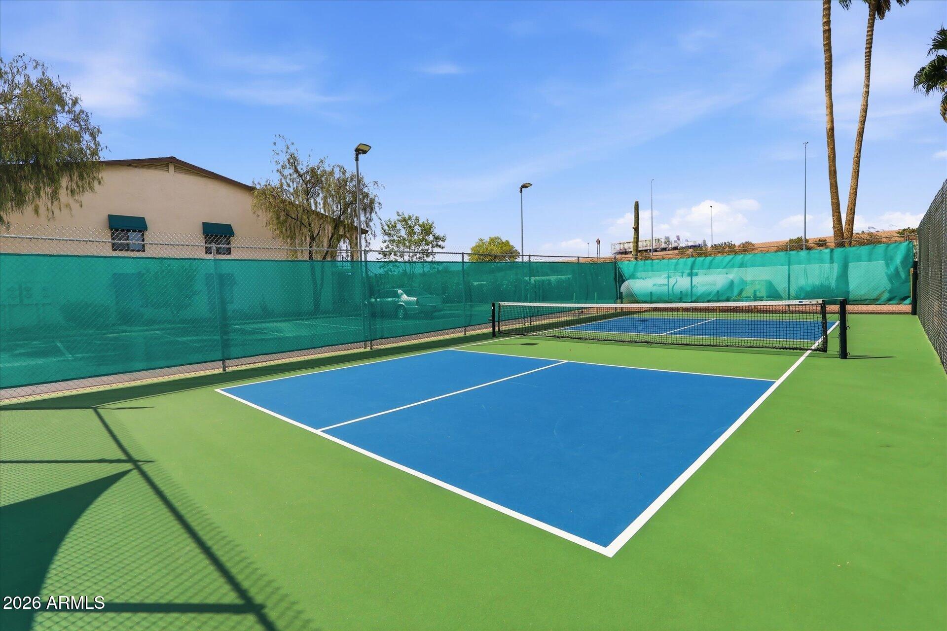 3270 South Goldfield Road, Unit 716 Apache Junction, AZ 85119 - Photo 21 of 36 a view of an outdoor space and basketball court