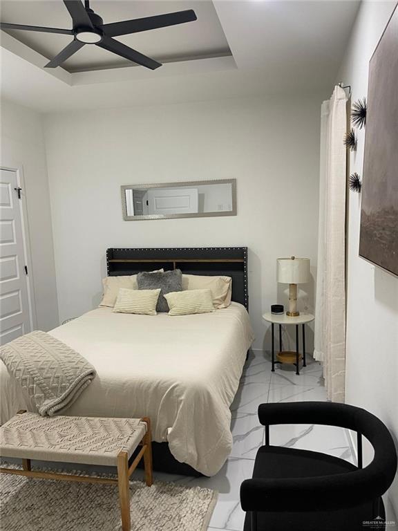 607 Buccaneer Drive, Unit 4 Hidalgo, TX 78557 - Photo 7 of 9 a bedroom with a bed and wooden floor