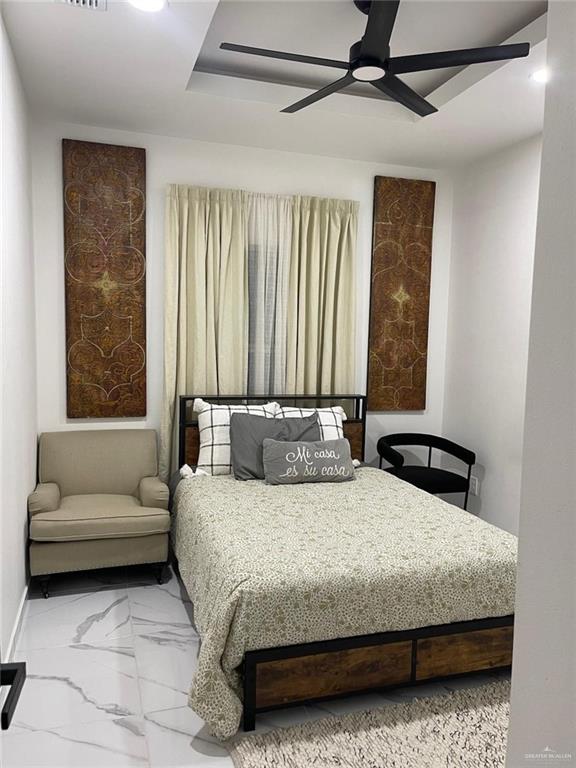 607 Buccaneer Drive, Unit 4 Hidalgo, TX 78557 - Photo 9 of 9 a bedroom with a bed couch and a window