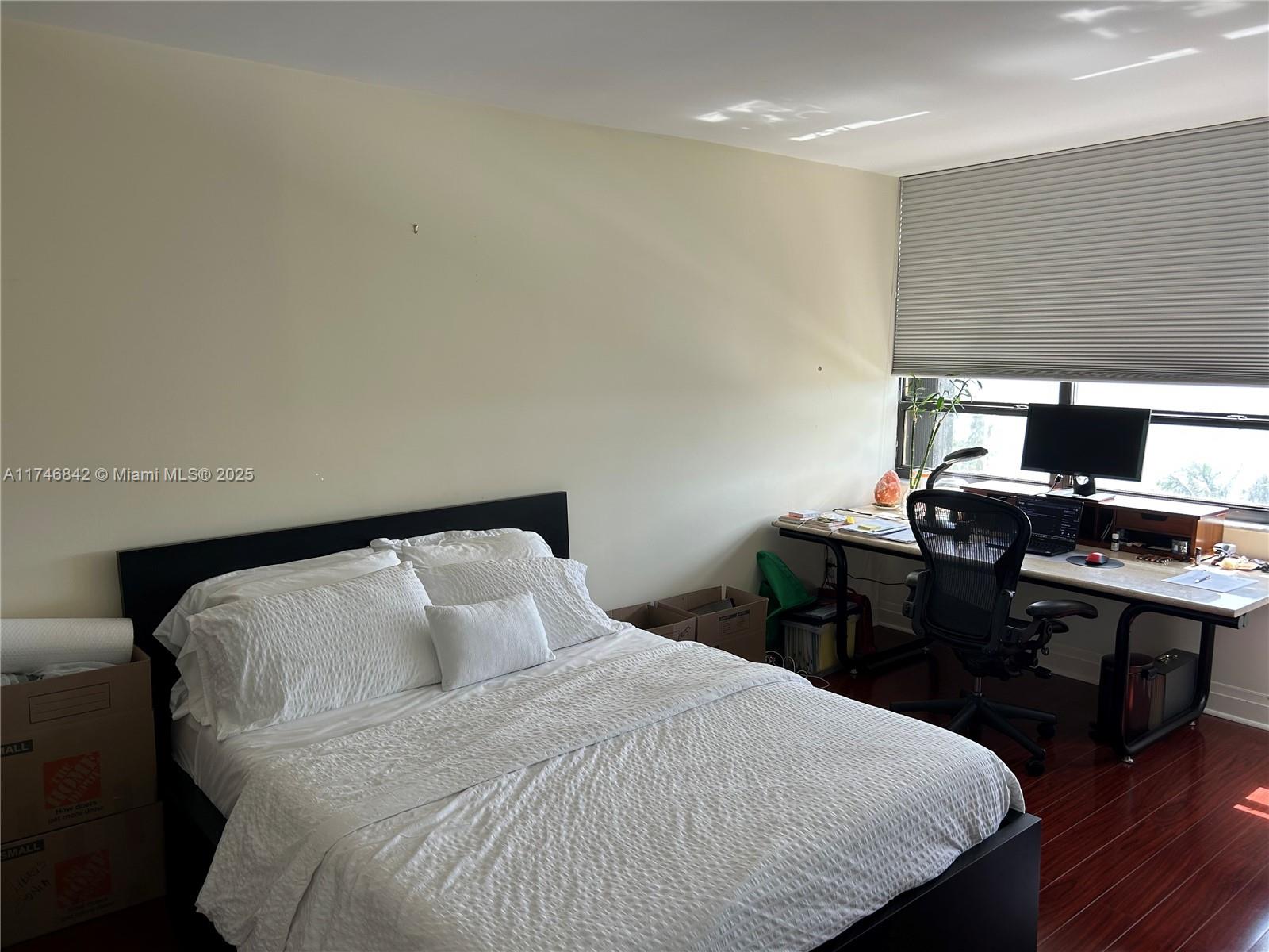 Miami-Dade County Miami, FL 33181 - Photo 15 of 19 a bedroom with a bed and a desk