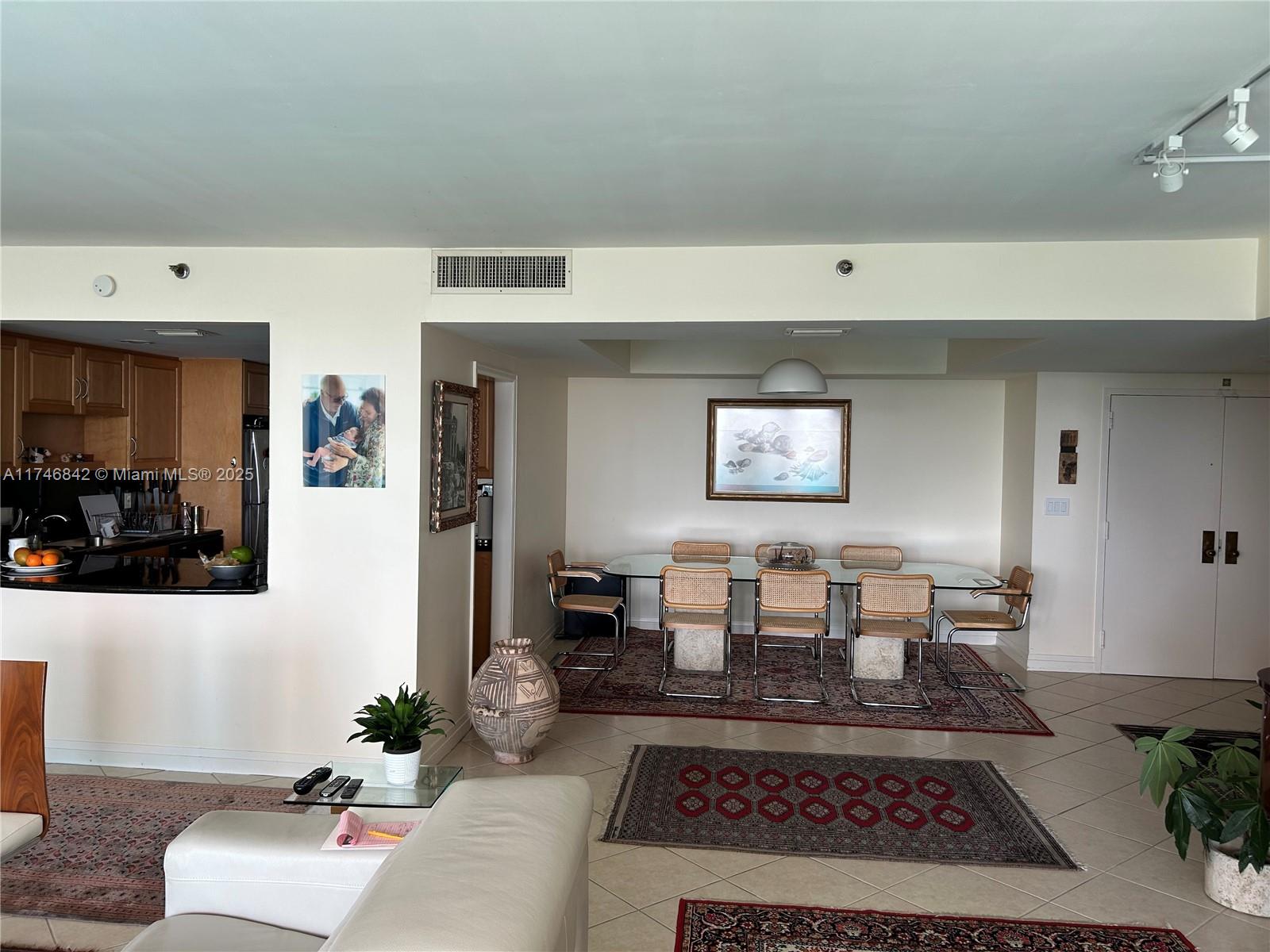 Miami-Dade County Miami, FL 33181 - Photo 8 of 19 a living room with furniture and a rug