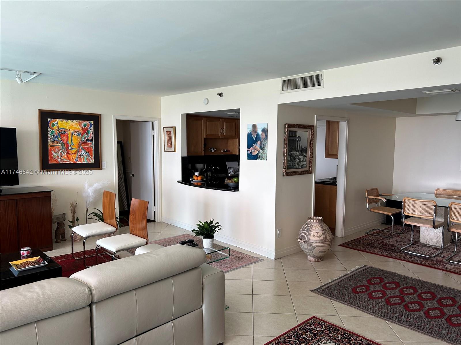 Miami-Dade County Miami, FL 33181 - Photo 9 of 19 a living room with furniture and a flat screen tv
