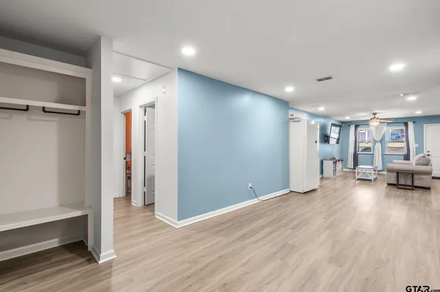 a view of a livingroom with furniture and wooden floor
