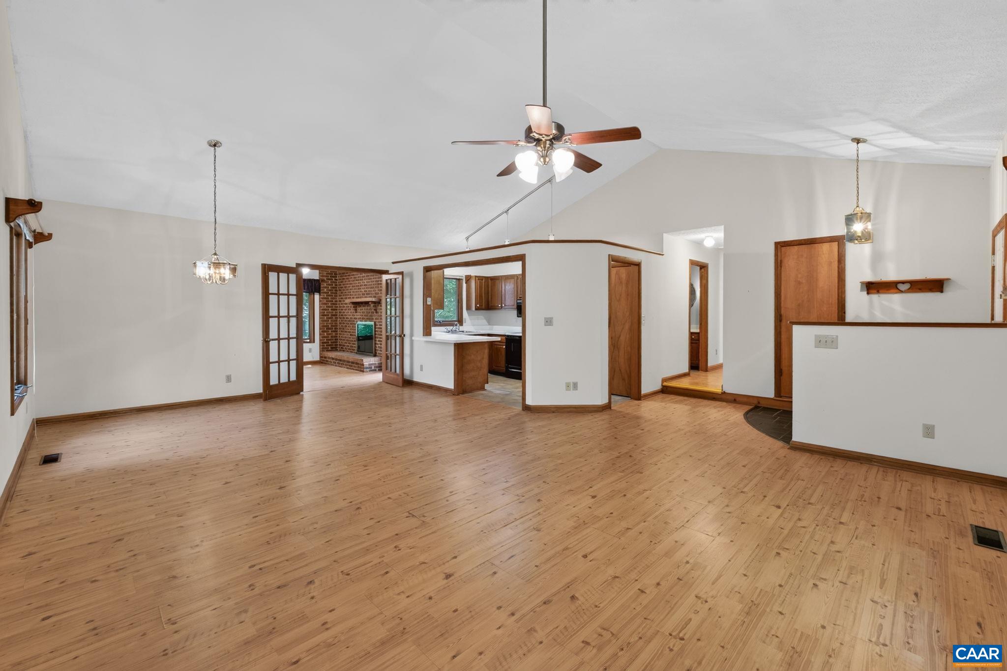 9 Timberlake Terrace Palmyra, VA 22963 - Photo 5 of 35 a view of a kitchen with a refrigerator a ceiling fan and wooden floor
