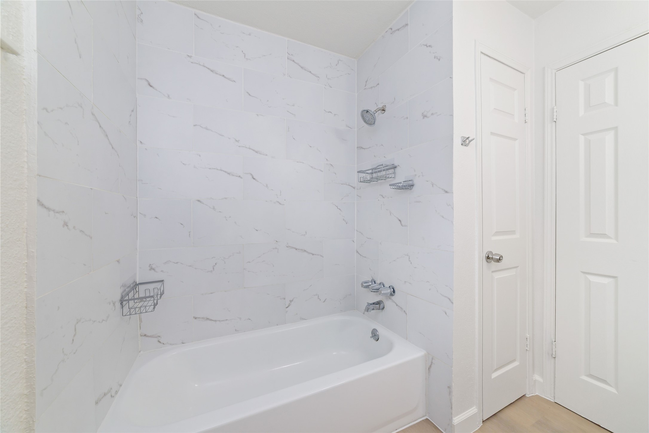 5023 Monteith Drive Spring, TX 77373 - Photo 18 of 20 Shower and bath area with a window for natural light, creating a bright and refreshing space to start or end your day.
