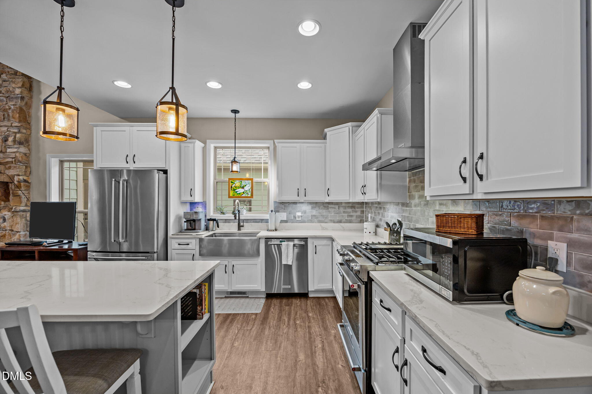 3225 Back Acres Road Efland, NC 27243 - Photo 10 of 57 a kitchen with kitchen island granite countertop a sink a counter space appliances and cabinets