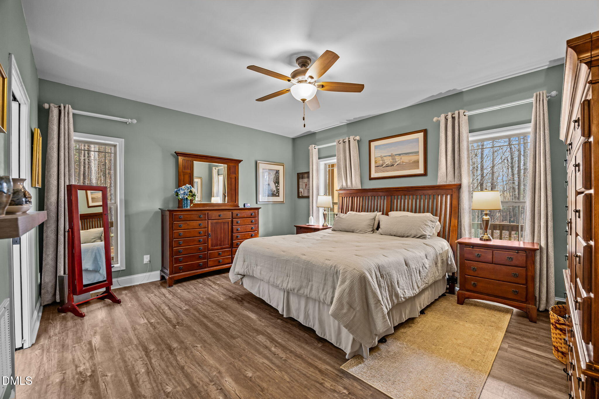 3225 Back Acres Road Efland, NC 27243 - Photo 13 of 57 a bedroom with a bed and a chandelier