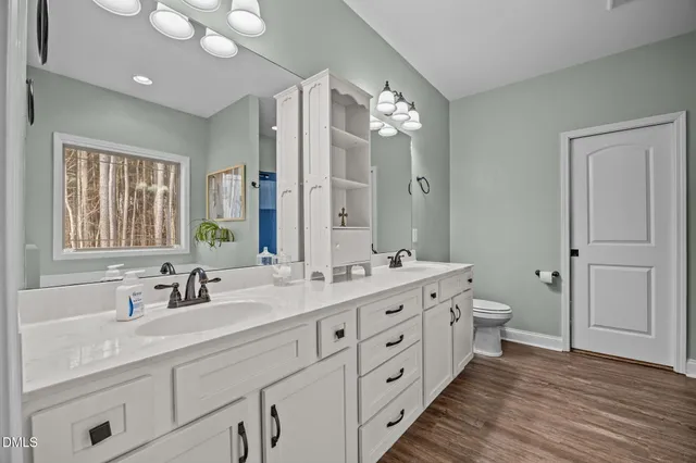 a double vanity sink with mirror
