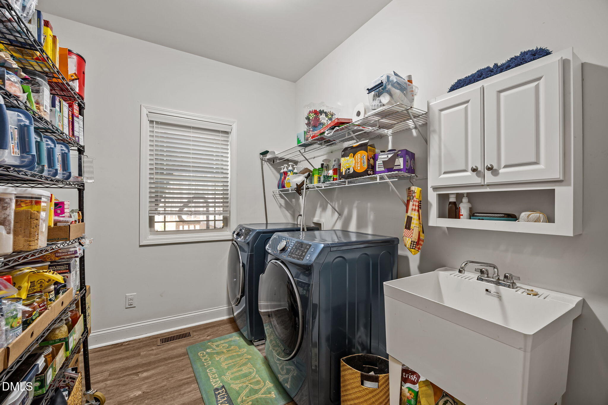 3225 Back Acres Road Efland, NC 27243 - Photo 17 of 57 a utility room with fridge dryer and washer