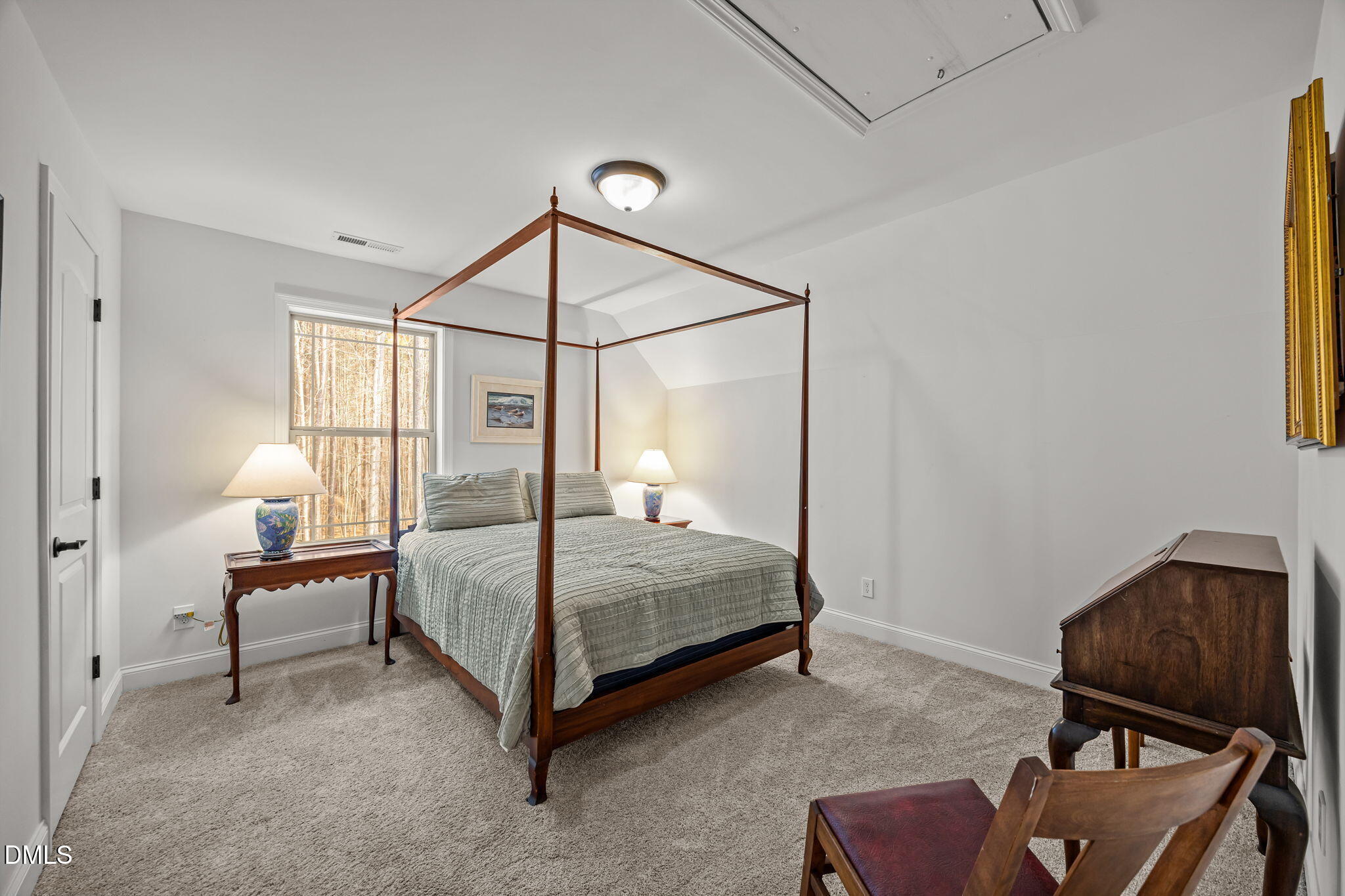 3225 Back Acres Road Efland, NC 27243 - Photo 24 of 57 a bedroom with a bed window and a chair