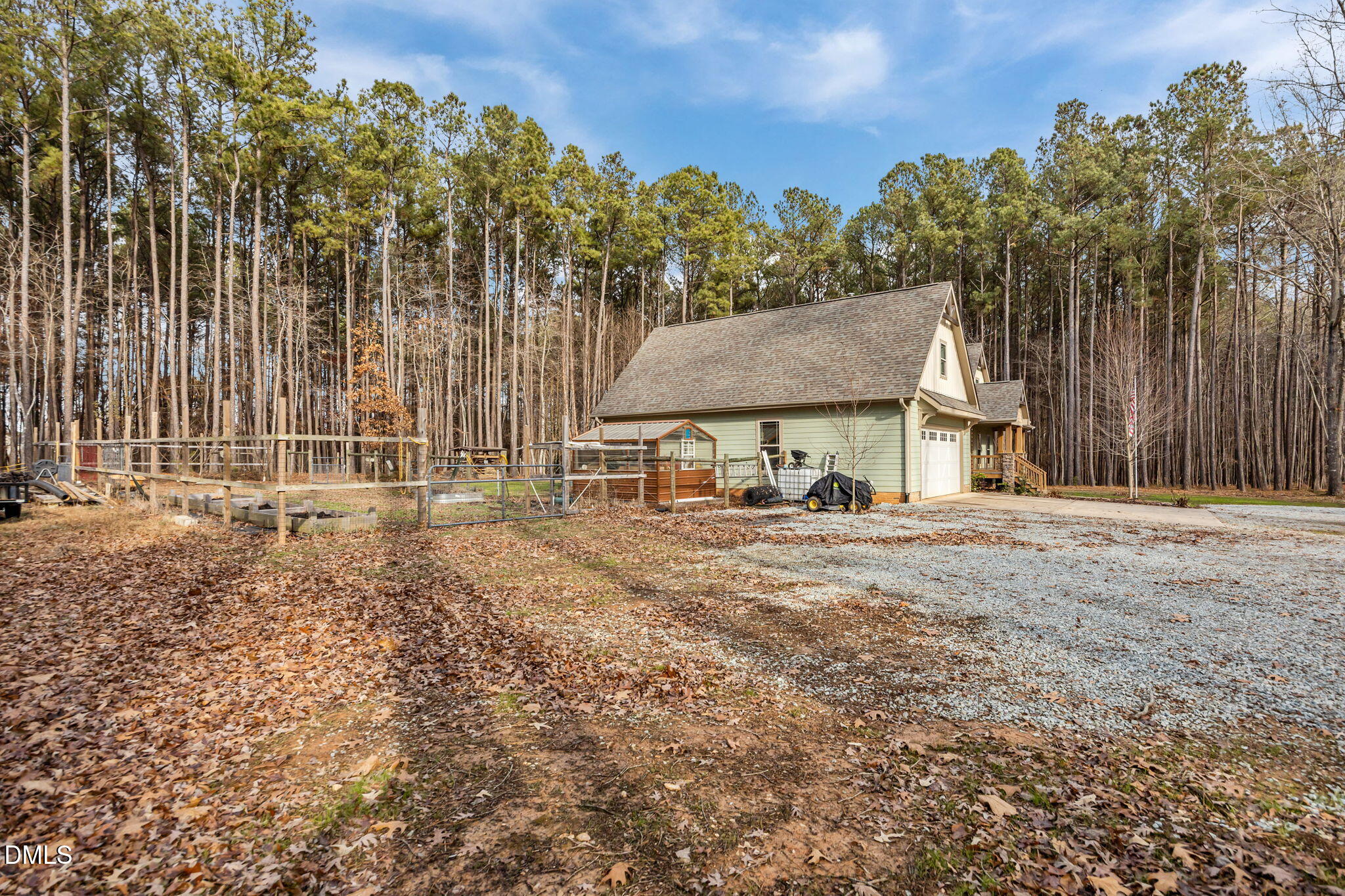 3225 Back Acres Road Efland, NC 27243 - Photo 29 of 57 a backyard of a house with table and chairs