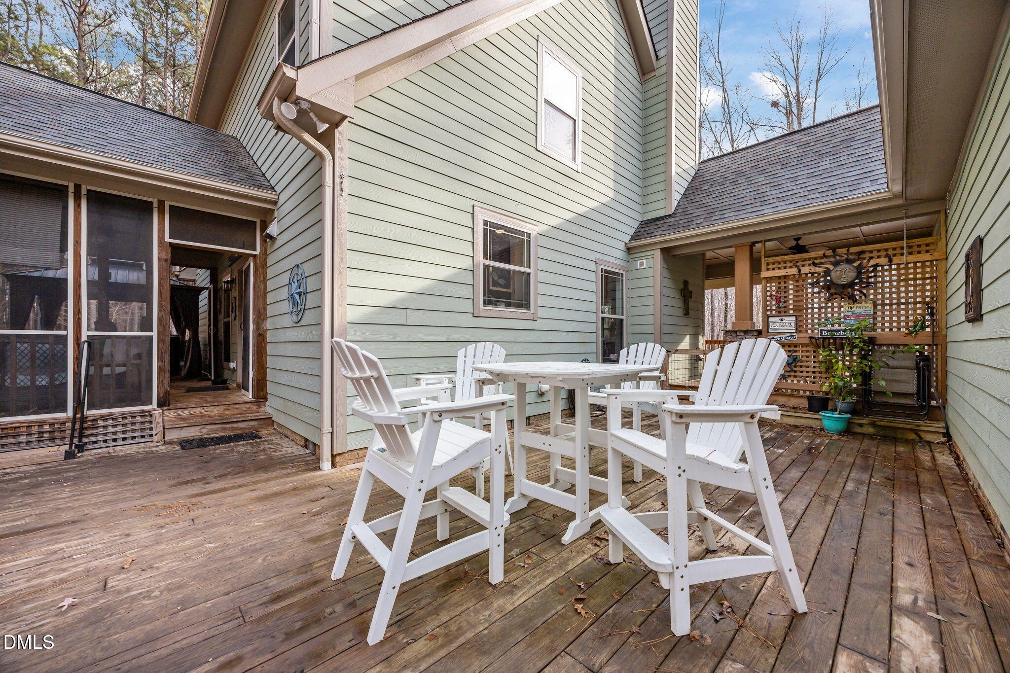3225 Back Acres Road Efland, NC 27243 - Photo 38 of 57 a view of a patio with table and chairs with wooden floor and fence