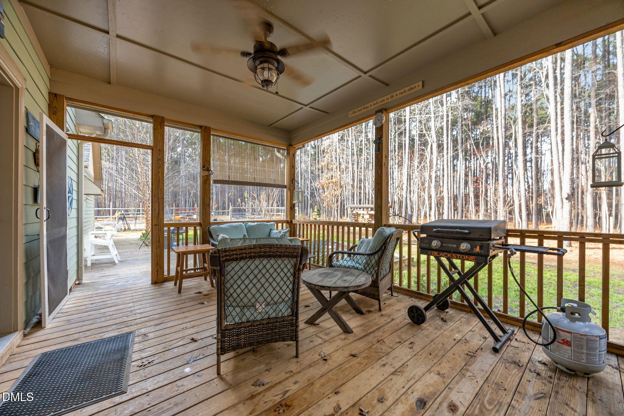 3225 Back Acres Road Efland, NC 27243 - Photo 40 of 57 a view of a balcony with chairs and wooden floor