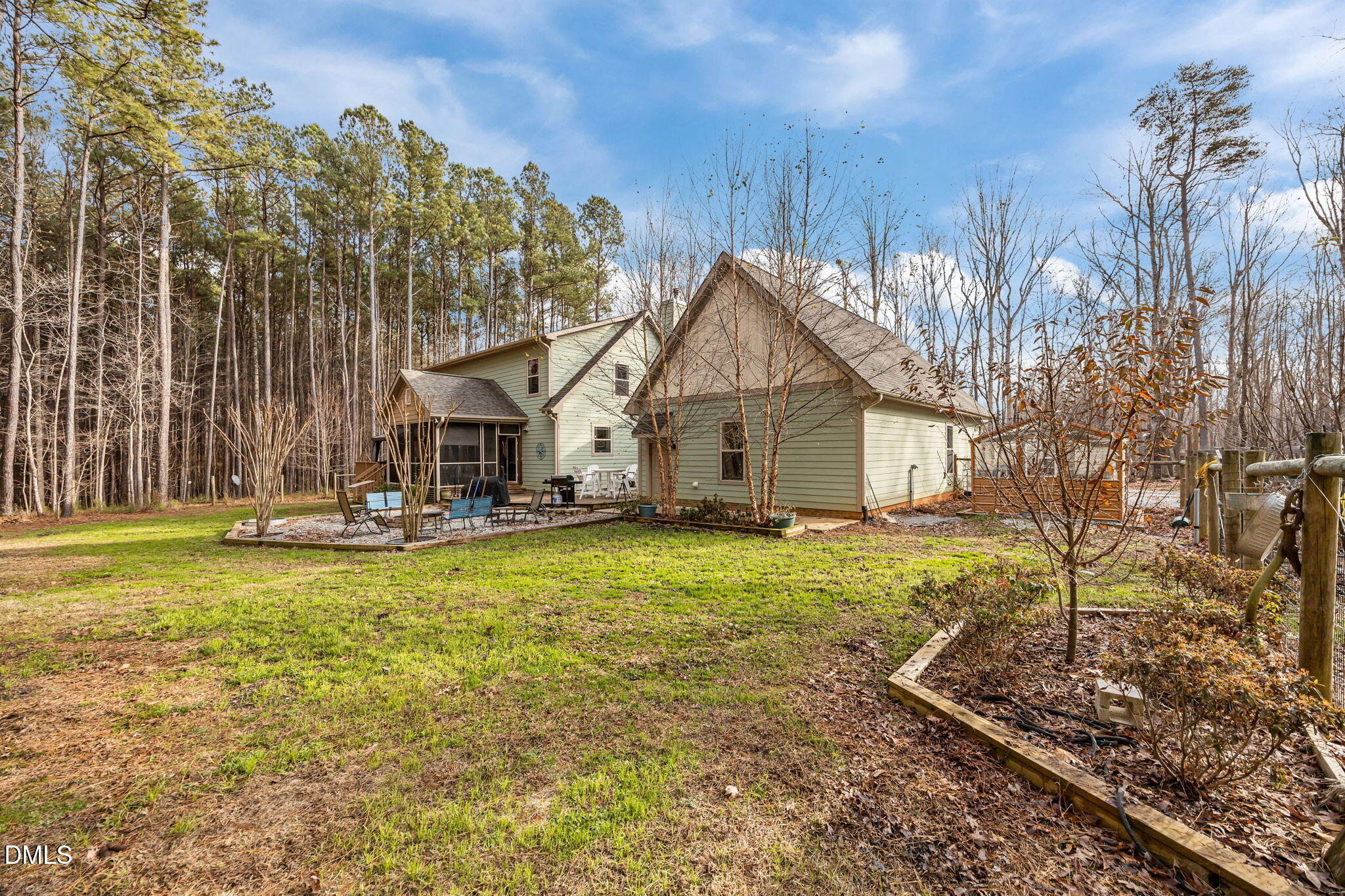 3225 Back Acres Road Efland, NC 27243 - Photo 46 of 57 a view of a house with a yard and sitting area