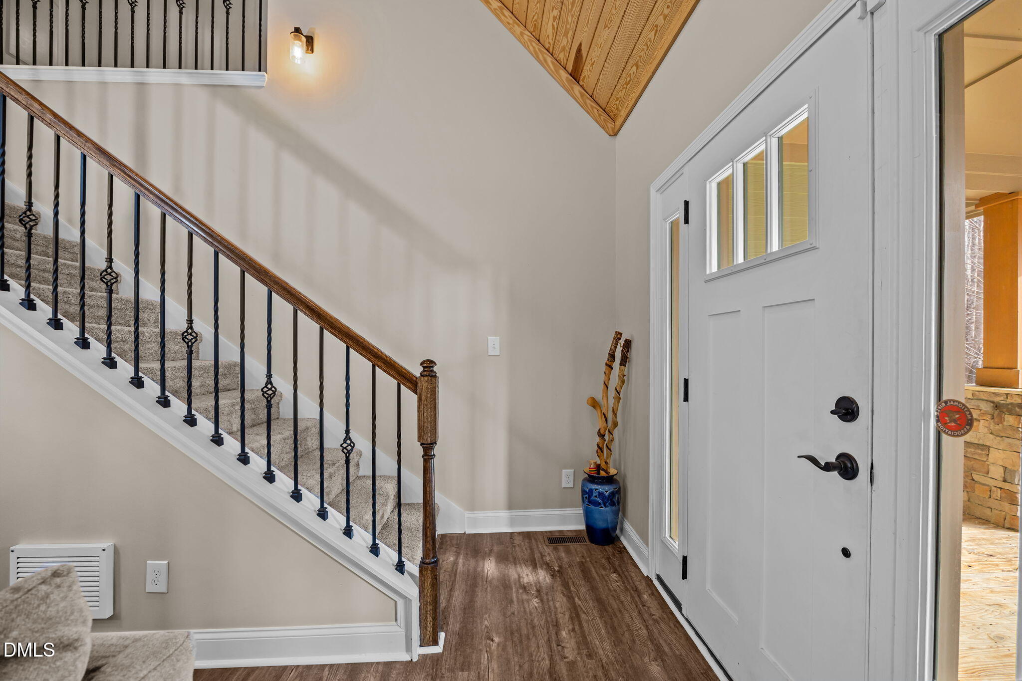 3225 Back Acres Road Efland, NC 27243 - Photo 49 of 57 a view of a hallway with wooden floor and staircase