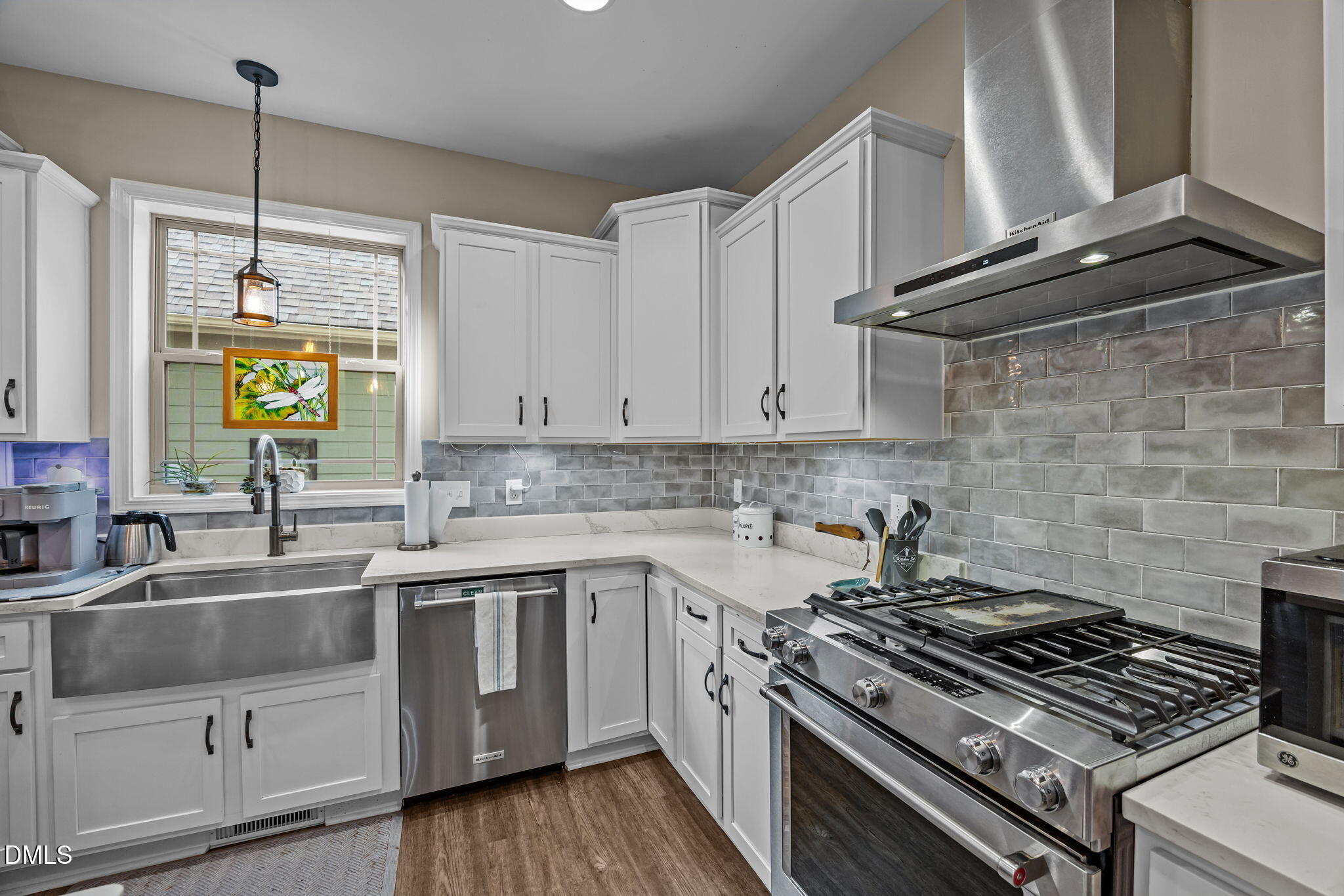 3225 Back Acres Road Efland, NC 27243 - Photo 7 of 57 a kitchen with stainless steel appliances a stove a sink and a counter space
