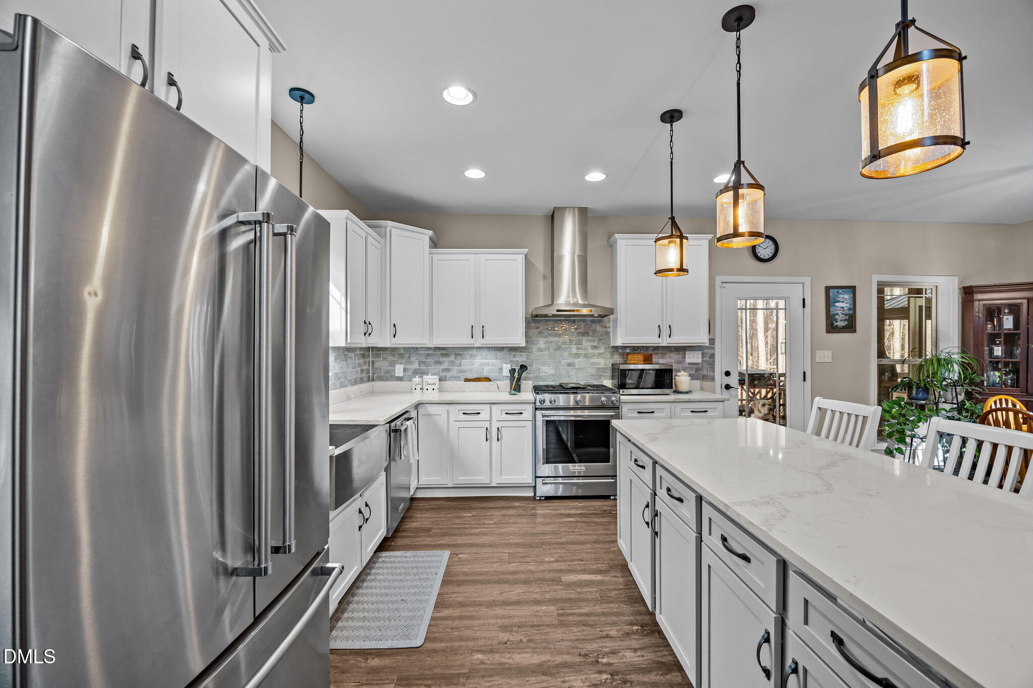 3225 Back Acres Road Efland, NC 27243 - Photo 9 of 57 a kitchen with stainless steel appliances granite countertop a refrigerator a sink and a stove