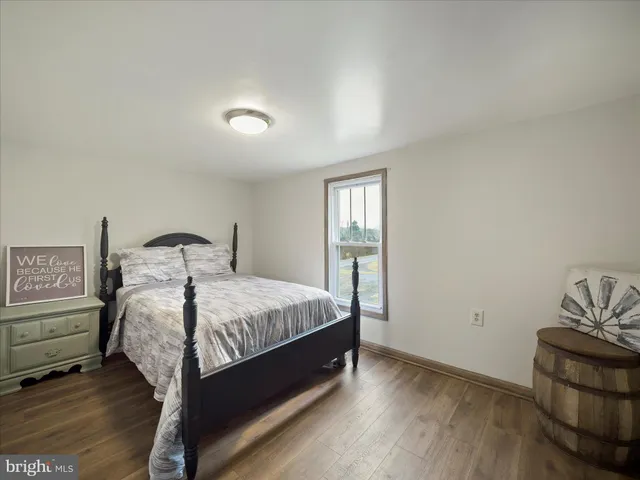 a bedroom with a bed and a dresser