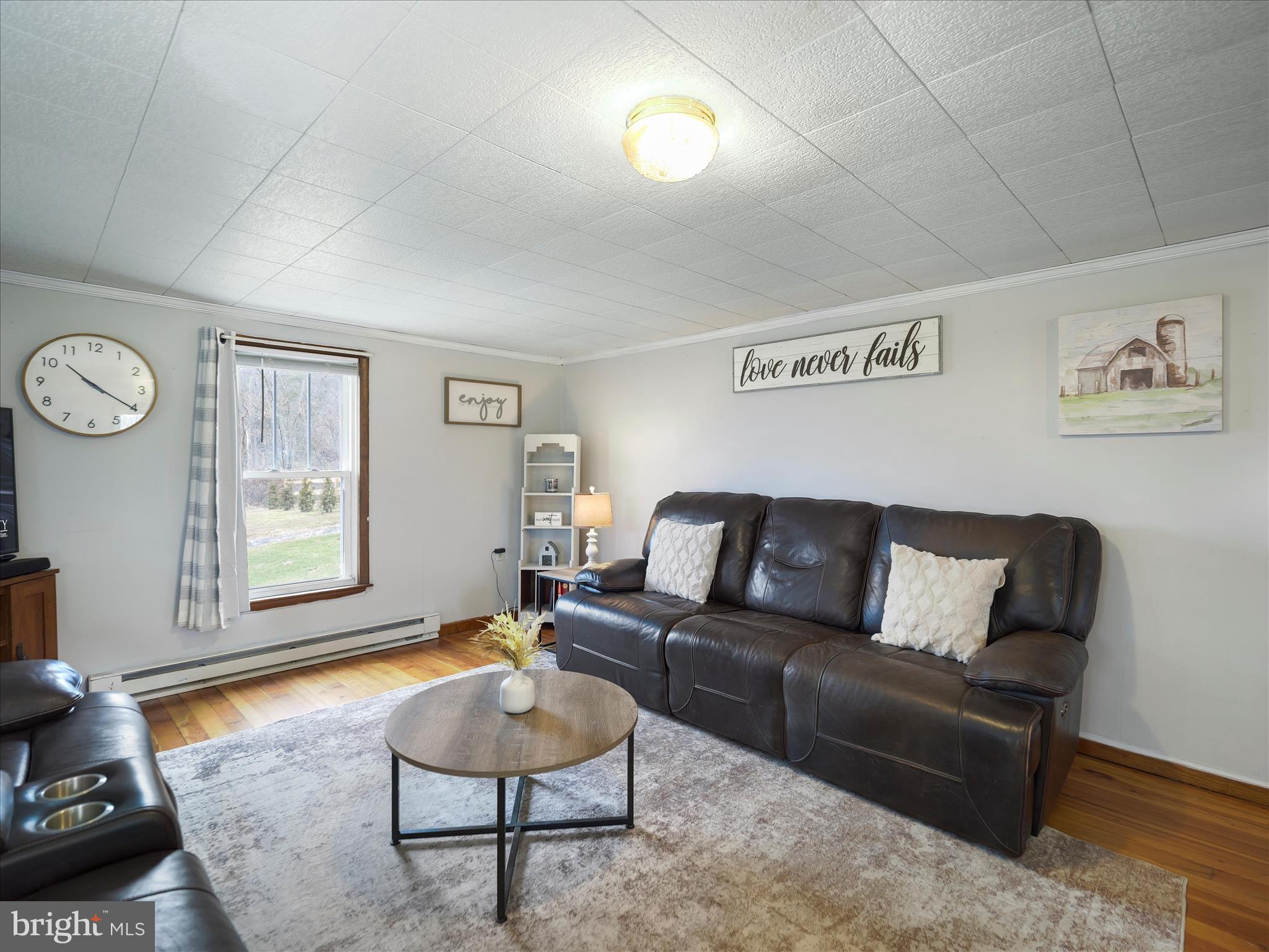 14628 Hollow Road Hancock, MD 21750 - Photo 21 of 54 a living room with furniture and a window