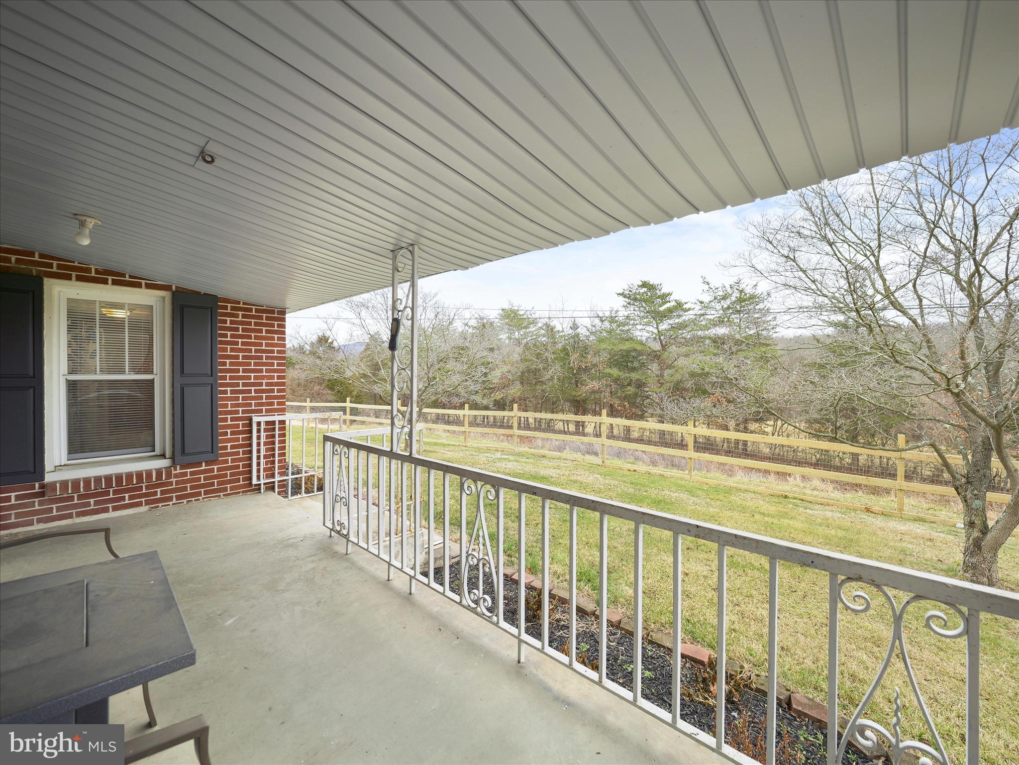 14628 Hollow Road Hancock, MD 21750 - Photo 25 of 54 a view of a roof deck with wooden floor and fence next to a yard