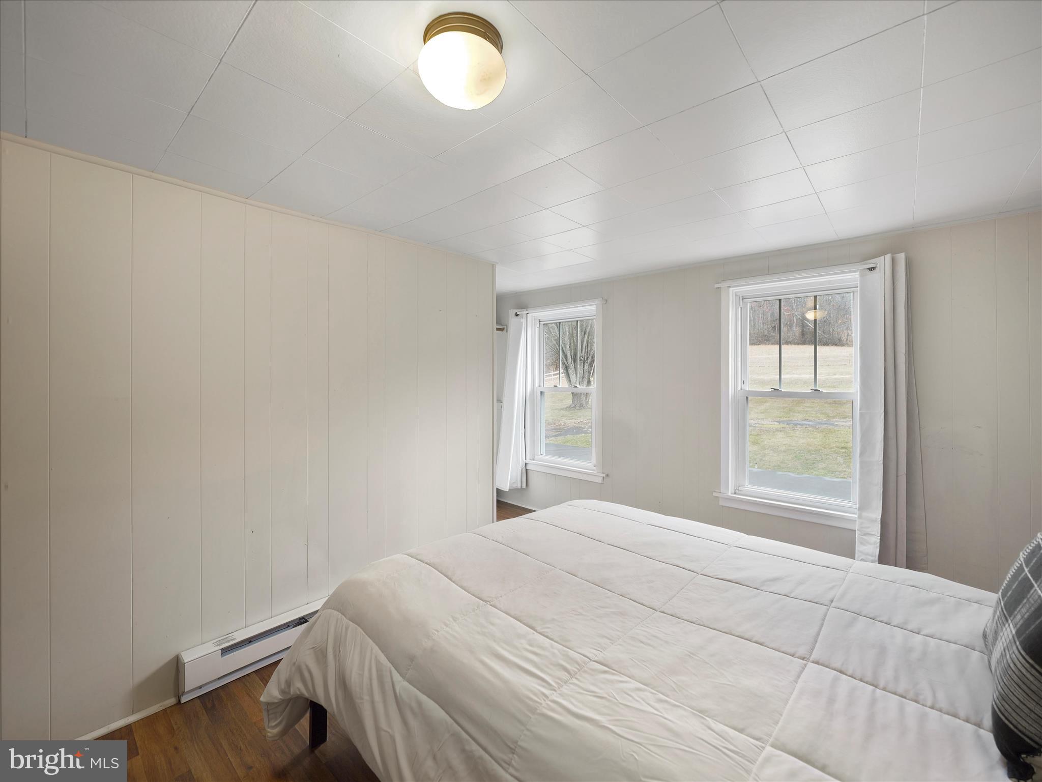 14628 Hollow Road Hancock, MD 21750 - Photo 26 of 54 a bedroom with a bed and a window