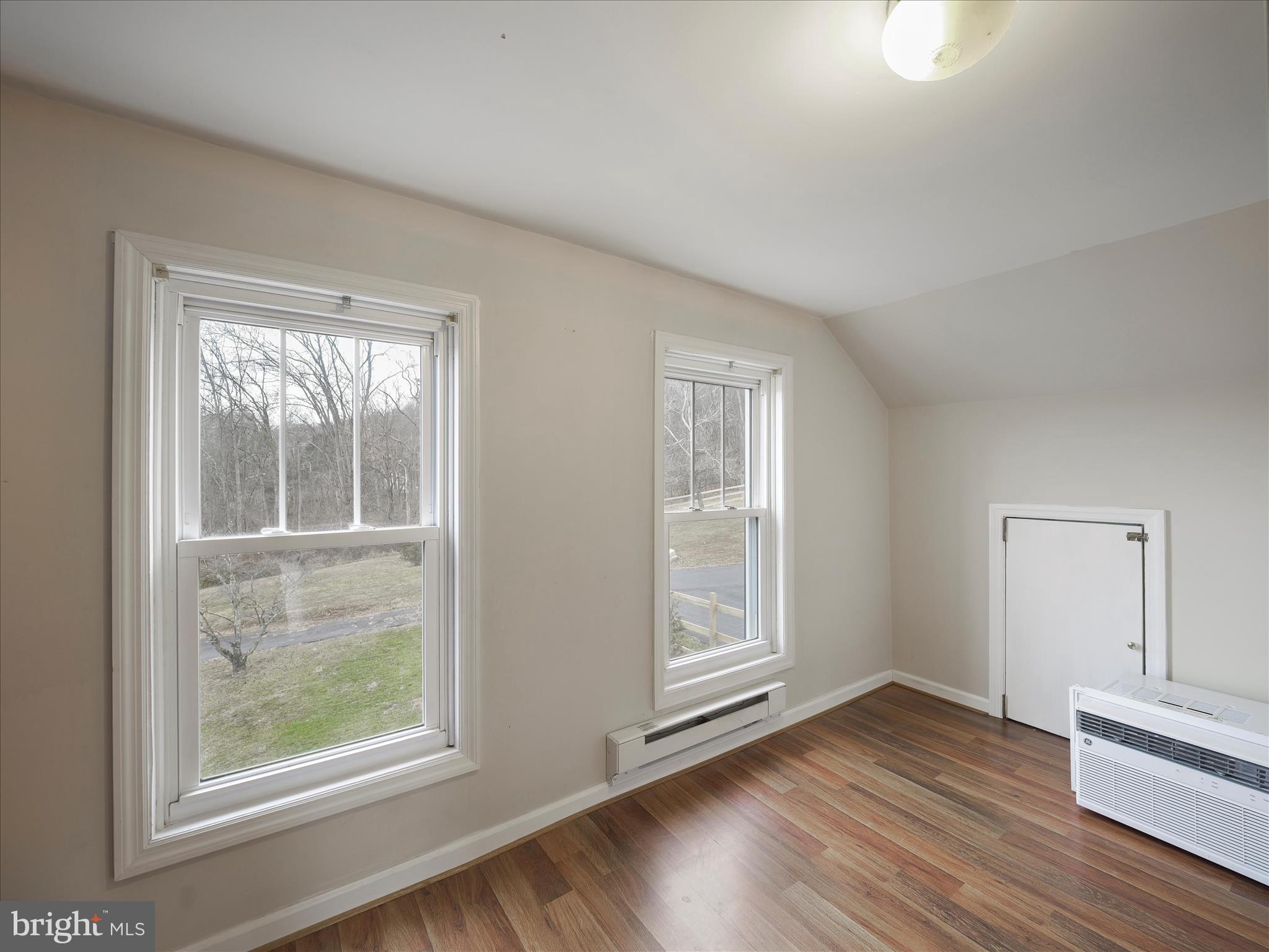 14628 Hollow Road Hancock, MD 21750 - Photo 30 of 54 an empty room with wooden floor and windows